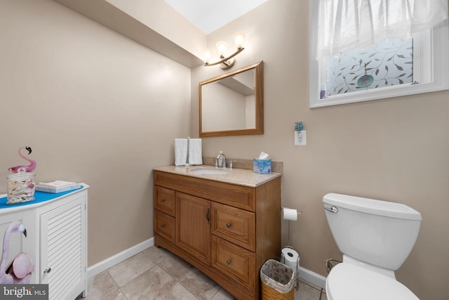 295 Chesapeake Ave, Prince Frederick, MD 20678 - bathroom with toilet, baseboards, and vanity