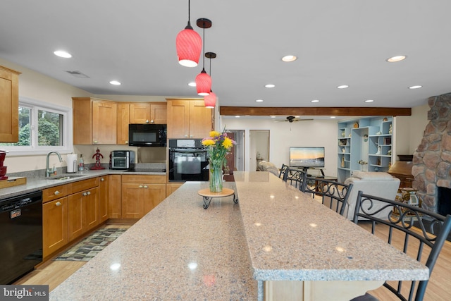 295 Chesapeake Ave, Prince Frederick, MD 20678 - kitchen with a sink, black appliances, ceiling fan, light stone counters, and recessed lighting