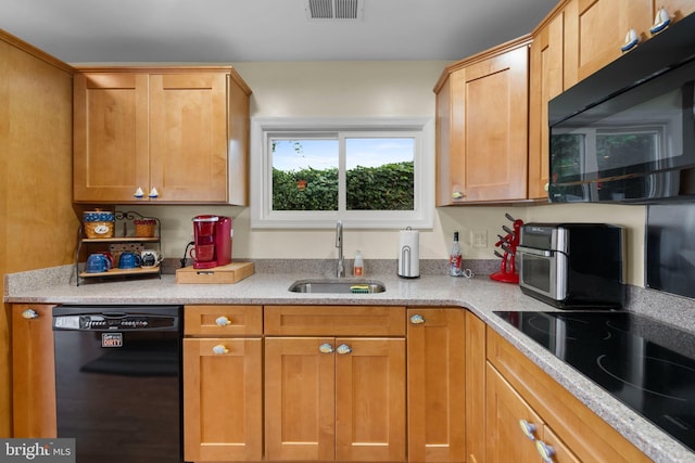 295 Chesapeake Ave, Prince Frederick, MD 20678 - kitchen with black appliances and a sink