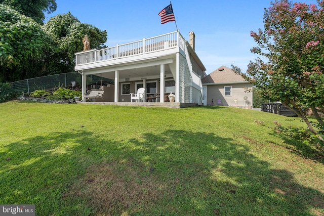 295 Chesapeake Ave, Prince Frederick, MD 20678 - back of property featuring a wooden deck, a patio, and a chimney