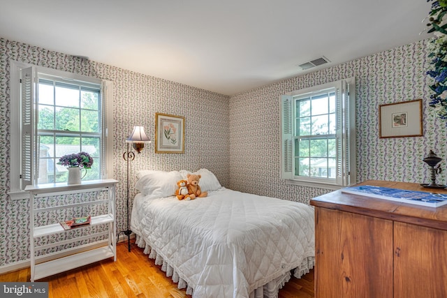 18919 Diary Rd, Montgomery Village, MD 20886 - bedroom featuring wood finished floors and wallpapered walls