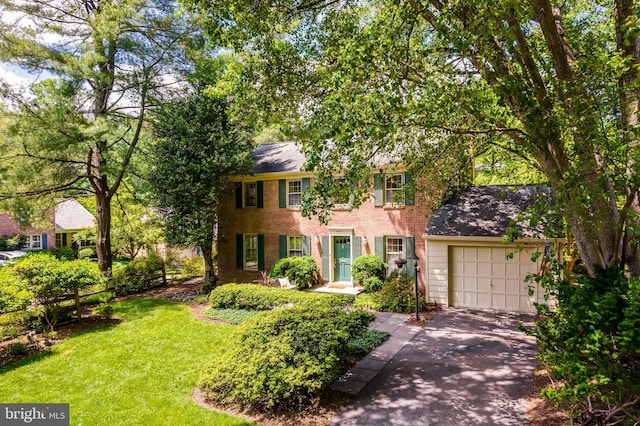 18919 Diary Rd, Montgomery Village, MD 20886 - colonial home with driveway, a garage, a front yard, and brick siding