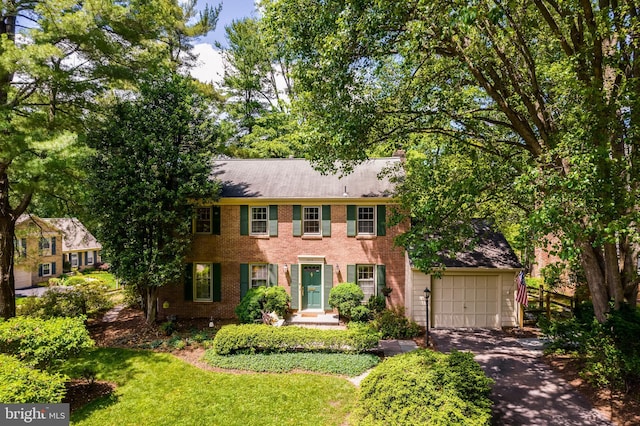 18919 Diary Rd, Montgomery Village, MD 20886 - colonial house featuring driveway, a garage, and brick siding