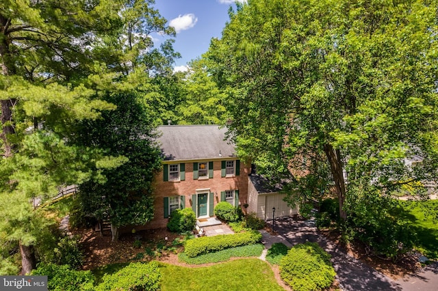 18919 Diary Rd, Montgomery Village, MD 20886 - colonial-style house with brick siding, a garage, and a shingled roof