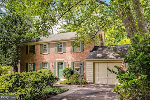 18919 Diary Rd, Montgomery Village, MD 20886 - colonial house with an attached garage, asphalt driveway, and brick siding