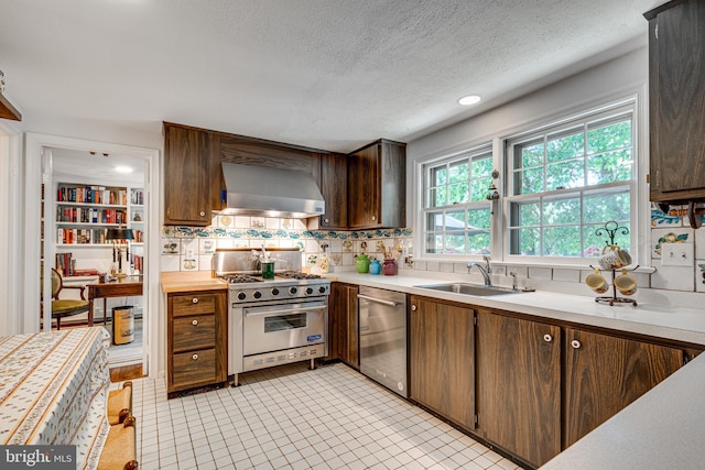 18919 Diary Rd, Montgomery Village, MD 20886 - kitchen with wall chimney range hood, stainless steel appliances, a sink, light countertops, and tasteful backsplash