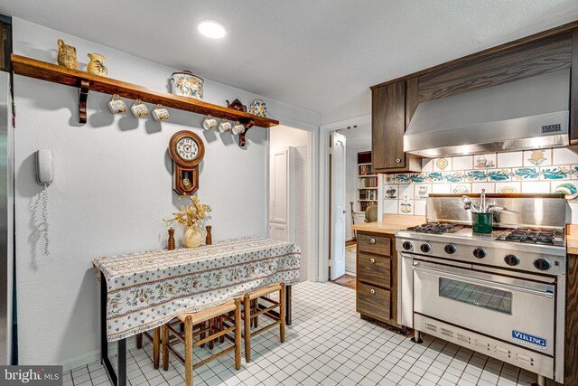 18919 Diary Rd, Montgomery Village, MD 20886 - kitchen featuring designer range, range hood, backsplash, and light tile patterned floors