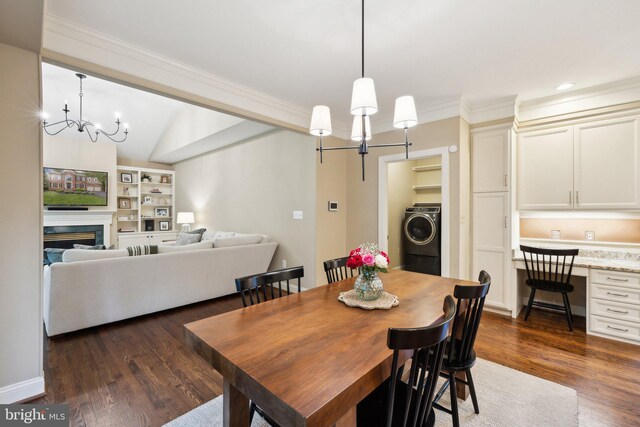 13016 Brookmead Dr, Manassas, VA 20112 - dining room with a chandelier, washer / clothes dryer, dark wood-style flooring, crown molding, and built in features
