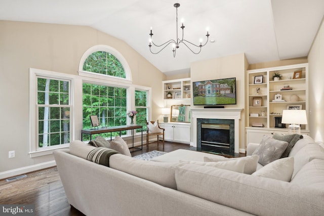 13016 Brookmead Dr, Manassas, VA 20112 - living area with a chandelier, high vaulted ceiling, a high end fireplace, wood finished floors, and baseboards