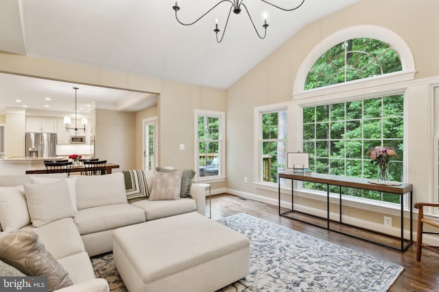 13016 Brookmead Dr, Manassas, VA 20112 - living area with a chandelier, healthy amount of natural light, wood finished floors, recessed lighting, and high vaulted ceiling