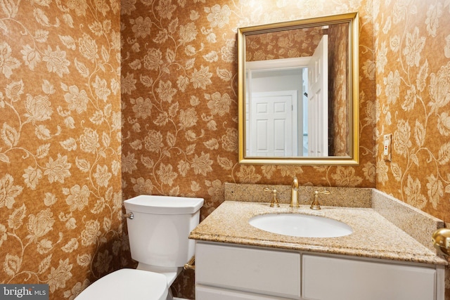 13016 Brookmead Dr, Manassas, VA 20112 - bathroom featuring wallpapered walls, vanity, and toilet