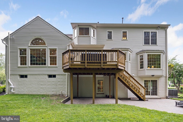 13016 Brookmead Dr, Manassas, VA 20112 - back of property with a wooden deck, a patio area, a yard, central air condition unit, and stairway