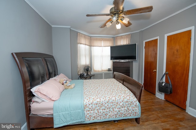 3444 G St, Philadelphia, PA 19134 - bedroom featuring crown molding, wood finished floors, a ceiling fan, two closets, and baseboards