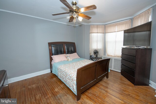 3444 G St, Philadelphia, PA 19134 - bedroom featuring baseboards, ornamental molding, wood finished floors, radiator heating unit, and a ceiling fan