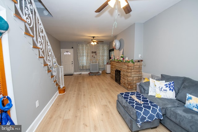3444 G St, Philadelphia, PA 19134 - living area featuring ceiling fan, stairs, hardwood / wood-style floors, and baseboards