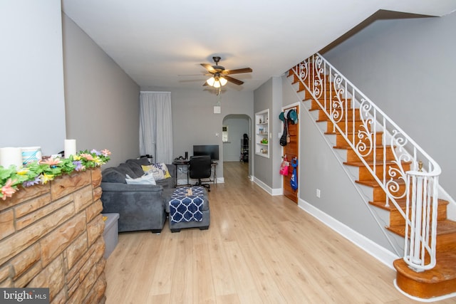 3444 G St, Philadelphia, PA 19134 - living room with arched walkways, ceiling fan, wood finished floors, stairway, and baseboards