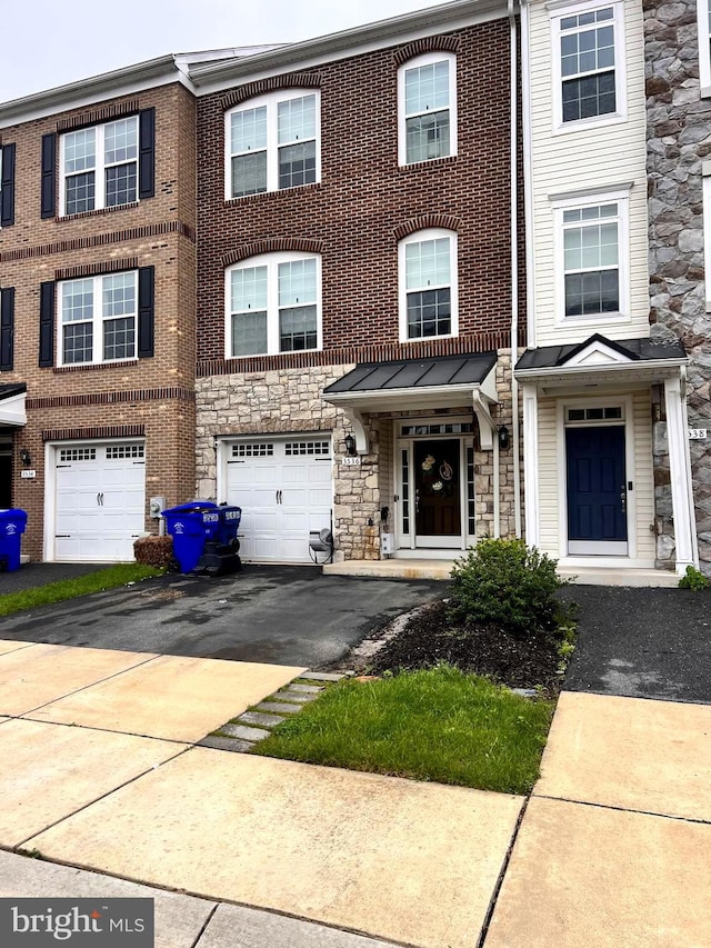 3536 Pipestone Pl, Waldorf, MD 20601 - townhome / multi-family property with driveway, a garage, and stone siding