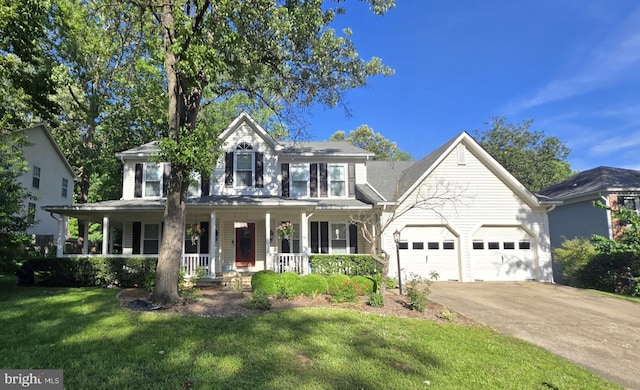 16719 Tintagel Ct, Dumfries, VA 22025 - view of front of home featuring an attached garage, a front lawn, concrete driveway, and a porch