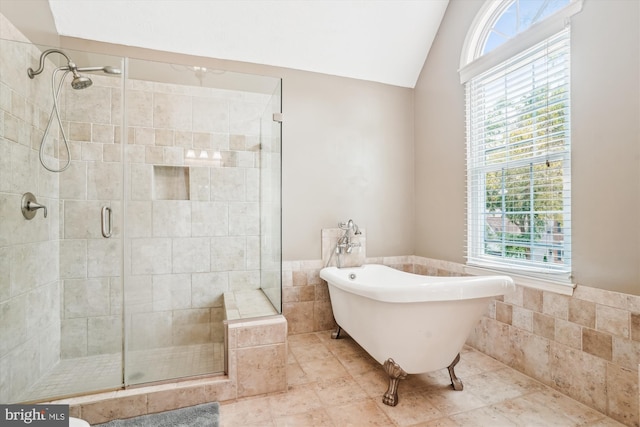 16719 Tintagel Ct, Dumfries, VA 22025 - bathroom with a shower stall, a soaking tub, vaulted ceiling, tile walls, and wainscoting