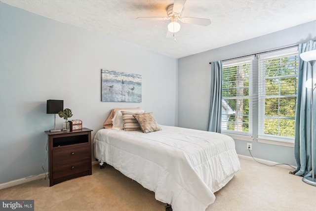 16719 Tintagel Ct, Dumfries, VA 22025 - bedroom with carpet floors, baseboards, a textured ceiling, and ceiling fan