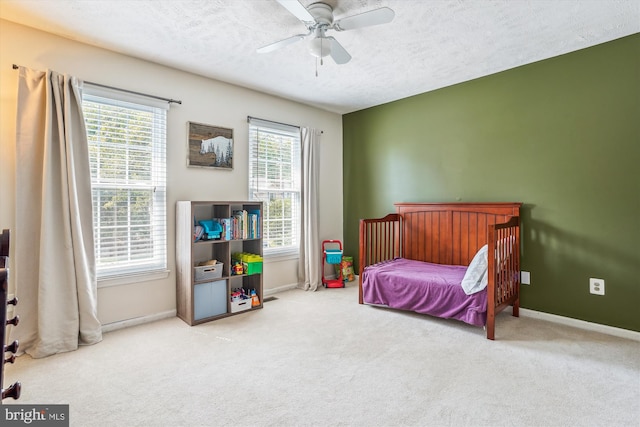 16719 Tintagel Ct, Dumfries, VA 22025 - carpeted bedroom featuring baseboards, a textured ceiling, and ceiling fan