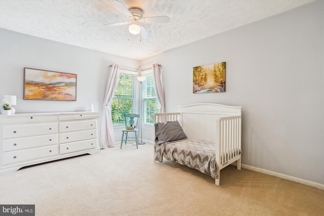 16719 Tintagel Ct, Dumfries, VA 22025 - carpeted bedroom with a textured ceiling, baseboards, and a ceiling fan