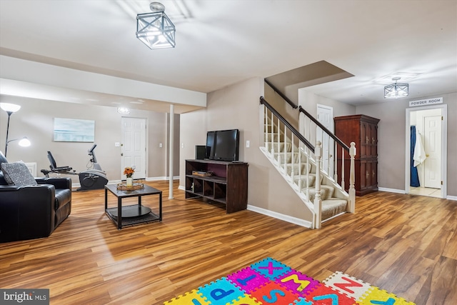 16719 Tintagel Ct, Dumfries, VA 22025 - living room featuring wood finished floors, stairs, and baseboards