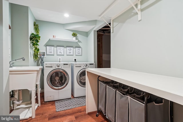 16719 Tintagel Ct, Dumfries, VA 22025 - laundry area featuring washer and clothes dryer, wood finished floors, and recessed lighting