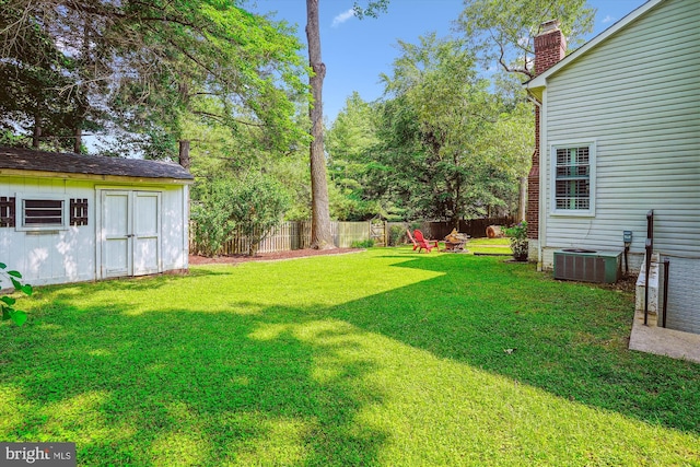 16719 Tintagel Ct, Dumfries, VA 22025 - view of yard featuring central air condition unit and a fire pit