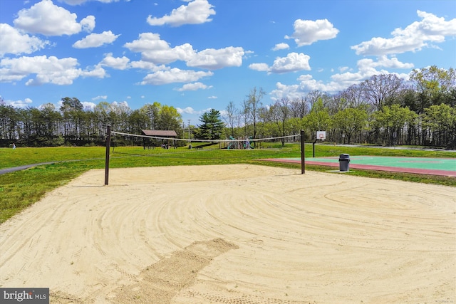 16719 Tintagel Ct, Dumfries, VA 22025 - view of community featuring volleyball court, community basketball court, a lawn, and view of wooded area