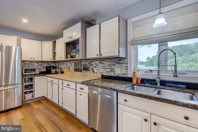 14298 S Union Church Rd, Ellendale, DE 19941 - kitchen featuring appliances with stainless steel finishes, a sink, open shelves, white cabinets, and recessed lighting