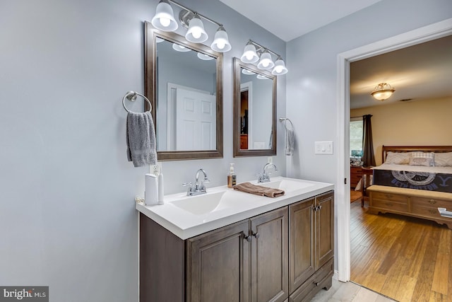 14298 S Union Church Rd, Ellendale, DE 19941 - ensuite bathroom with double vanity and wood finished floors