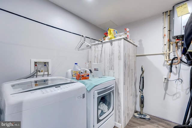 14298 S Union Church Rd, Ellendale, DE 19941 - washroom featuring separate washer and dryer and wood finished floors
