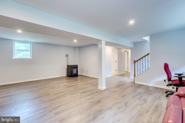 14298 S Union Church Rd, Ellendale, DE 19941 - basement with wood finished floors, stairs, baseboards, recessed lighting, and a wood stove