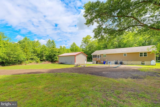 14298 S Union Church Rd, Ellendale, DE 19941 - view of grassy yard featuring central air condition unit