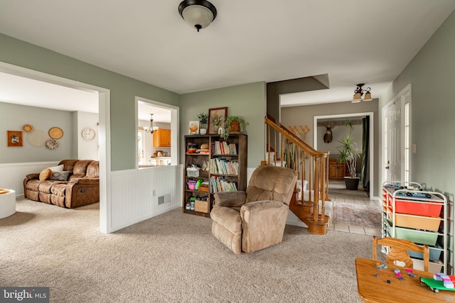 290 S Windy Mansion Rd, Denver, PA 17517 - living area with a wainscoted wall, stairs, and carpet flooring
