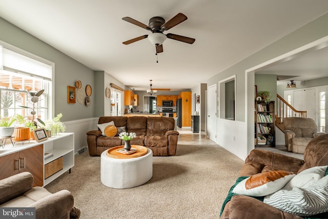 290 S Windy Mansion Rd, Denver, PA 17517 - living room with a ceiling fan, plenty of natural light, wainscoting, light carpet, and stairway