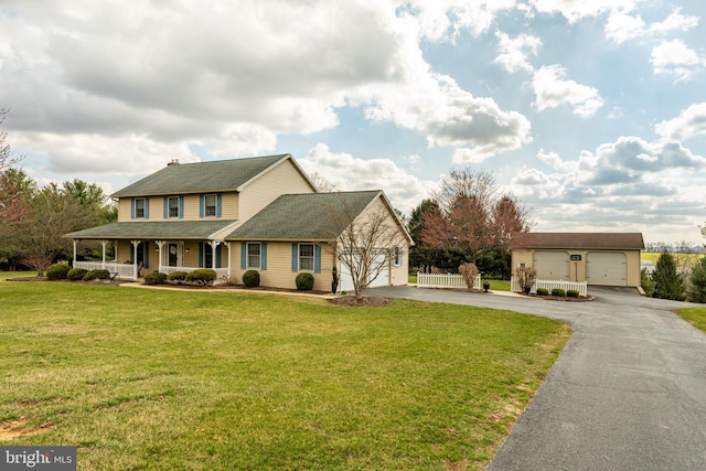 290 S Windy Mansion Rd, Denver, PA 17517 - view of front facade featuring covered porch, asphalt driveway, a front lawn, and roof with shingles