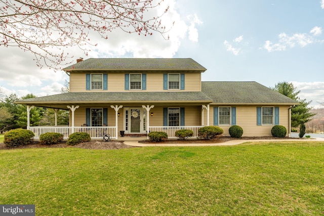 290 S Windy Mansion Rd, Denver, PA 17517 - farmhouse-style home featuring covered porch, a front yard, and a chimney