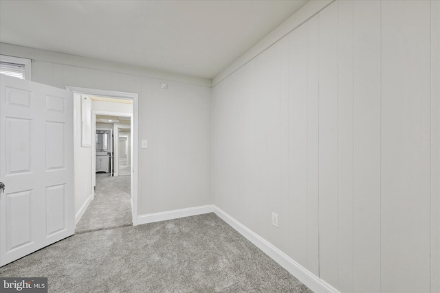 406 S Eaton St, Baltimore, MD 21224 - carpeted spare room with baseboards