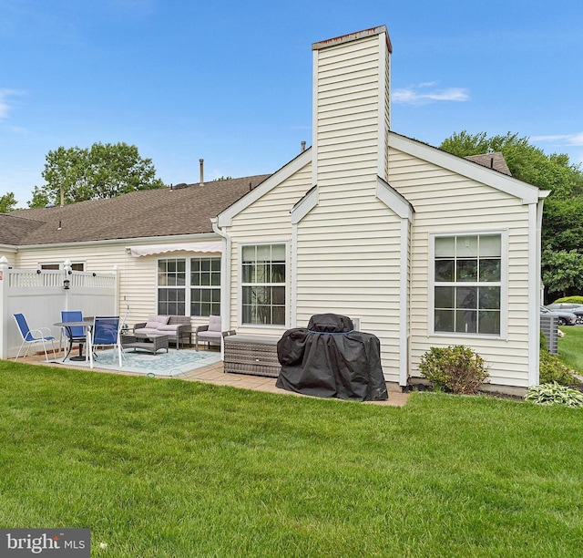 9 Peppergrass Dr N, Mount Laurel, NJ 08054 - rear view of house with an outdoor hangout area, a patio, a lawn, and a chimney