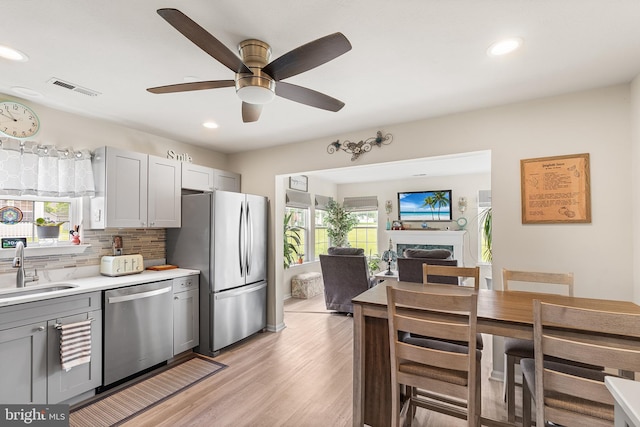 9 Peppergrass Dr N, Mount Laurel, NJ 08054 - kitchen with stainless steel appliances, a sink, gray cabinetry, healthy amount of natural light, and recessed lighting