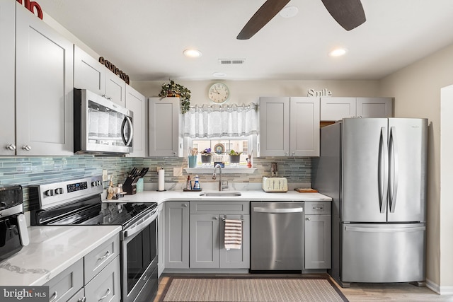 9 Peppergrass Dr N, Mount Laurel, NJ 08054 - kitchen featuring stainless steel appliances, a sink, light countertops, tasteful backsplash, and recessed lighting