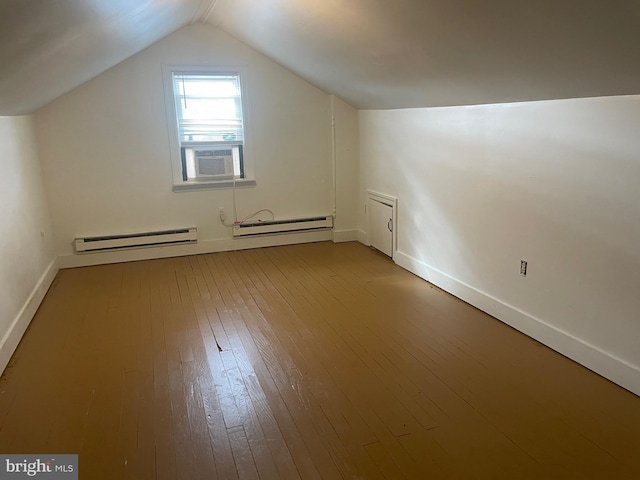 bonus room featuring a baseboard radiator, lofted ceiling, hardwood / wood-style floors, baseboards, and cooling unit