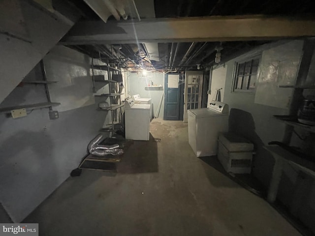 unfinished basement featuring washer and dryer