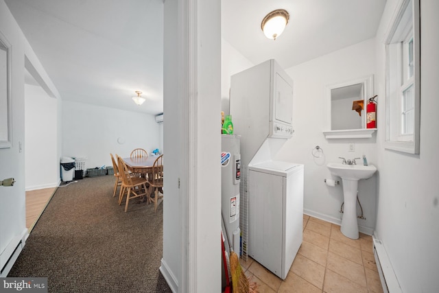 1211 Mcglaughlin Rd, Fishing Creek, MD 21634 - laundry area with stacked washer / dryer, baseboard heating, baseboards, and an AC wall unit