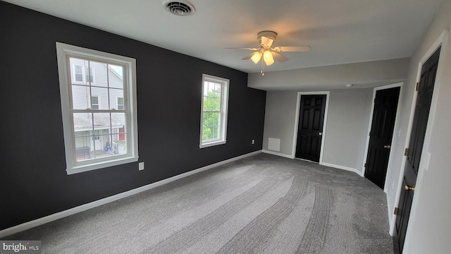 unfurnished bedroom featuring carpet flooring and baseboards