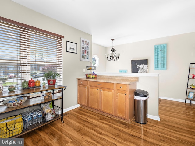 2524 Vineyard Ln, Crofton, MD 21114 - bar featuring healthy amount of natural light, light wood-style flooring, a chandelier, and baseboards