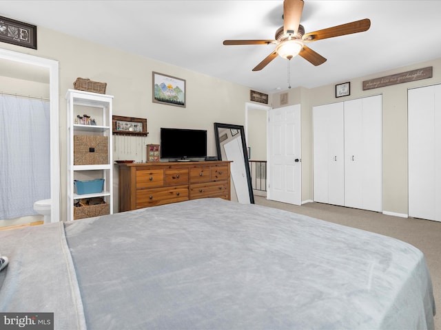 2524 Vineyard Ln, Crofton, MD 21114 - bedroom featuring two closets, ensuite bath, carpet floors, baseboards, and ceiling fan