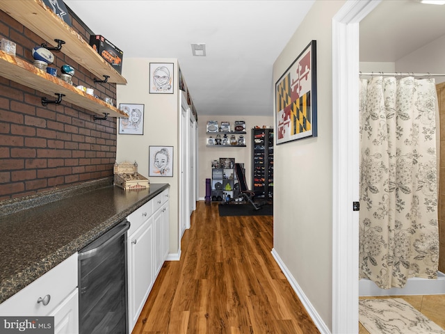 2524 Vineyard Ln, Crofton, MD 21114 - hall featuring wine cooler, wood finished floors, and baseboards